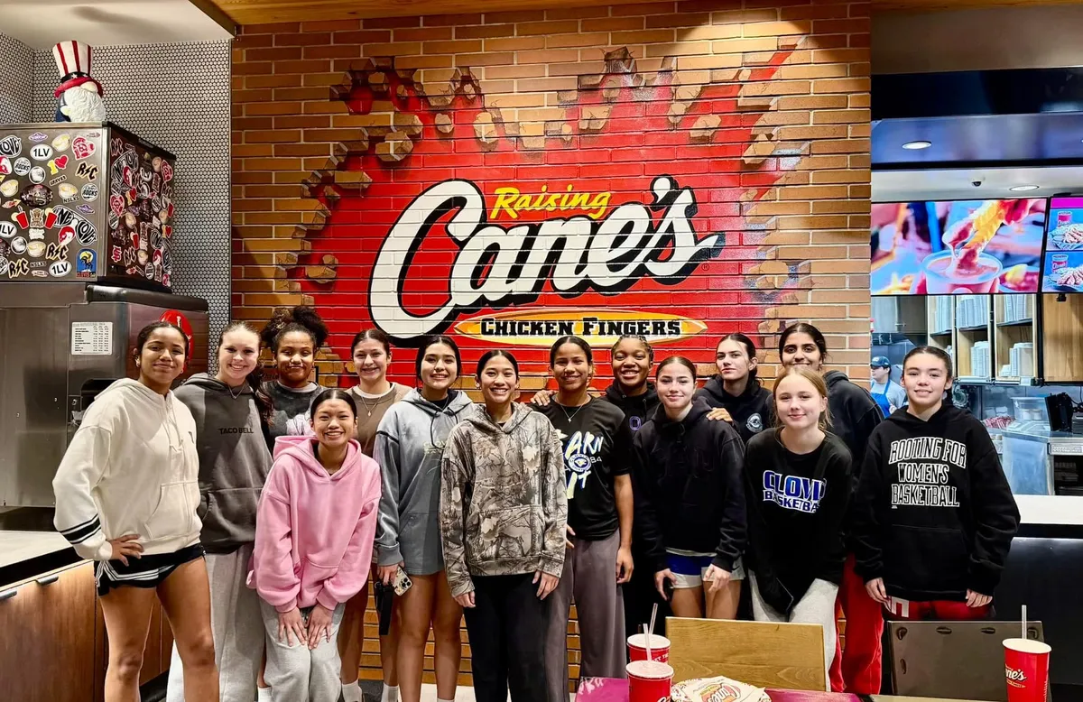 a woman is reading a resume at a table