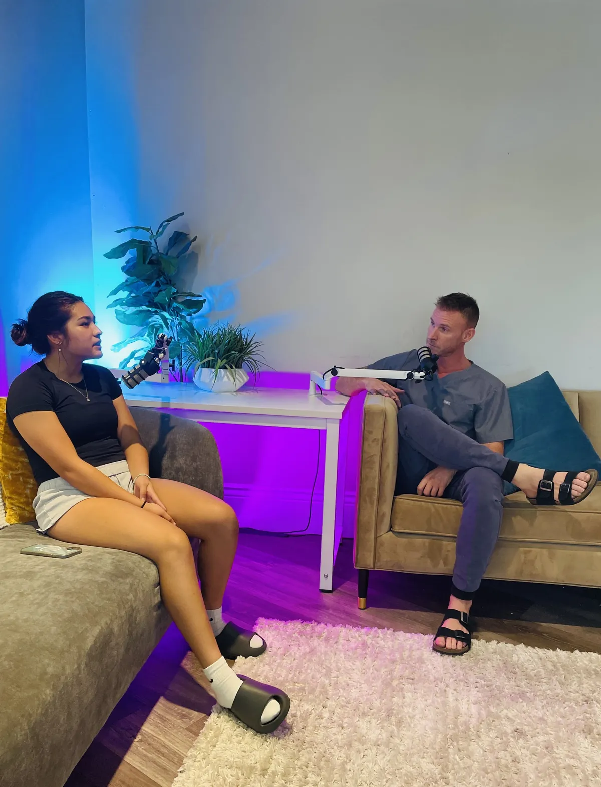 people sitting near table with laptop computer