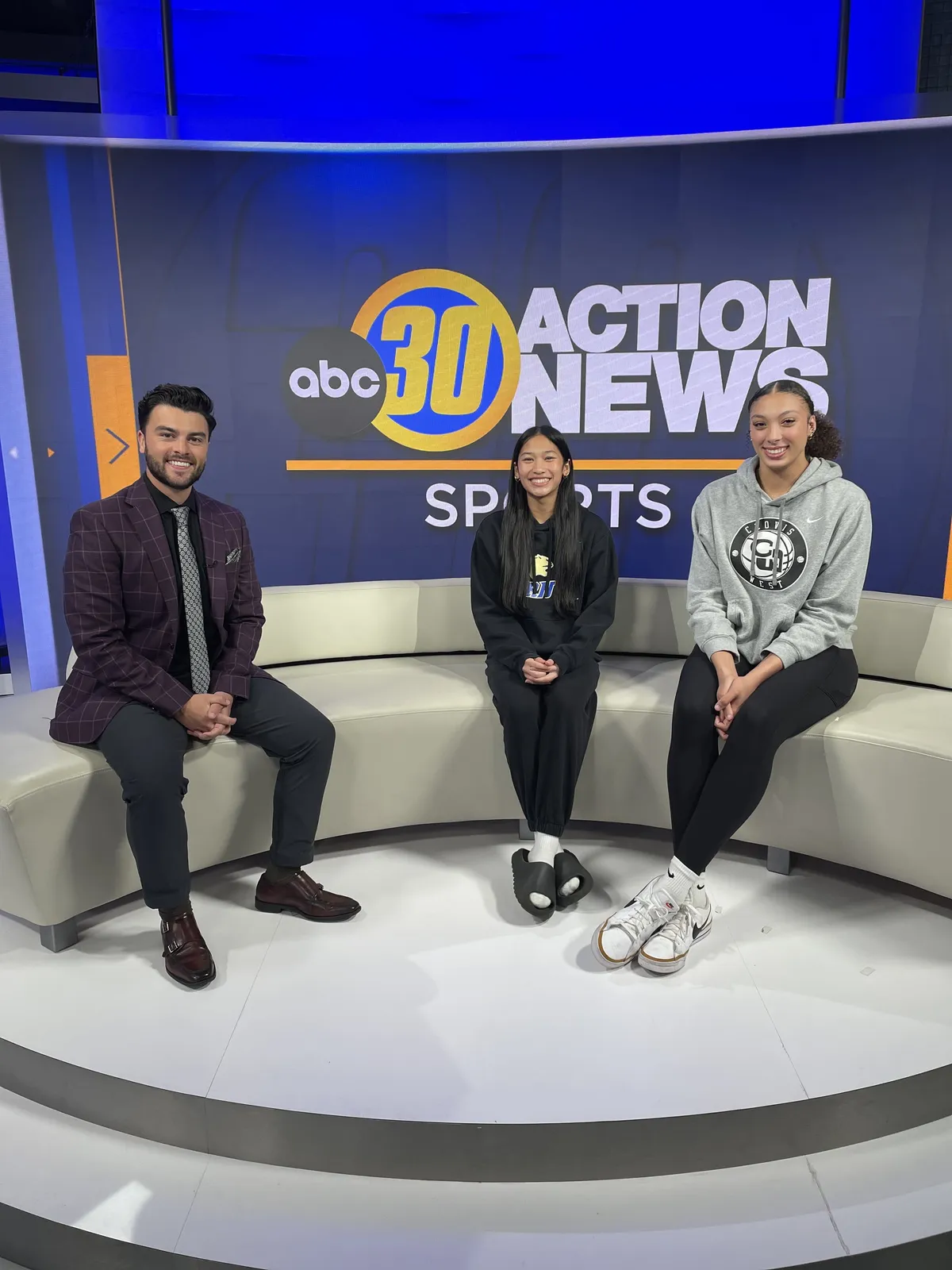 people sitting near table with laptop computer