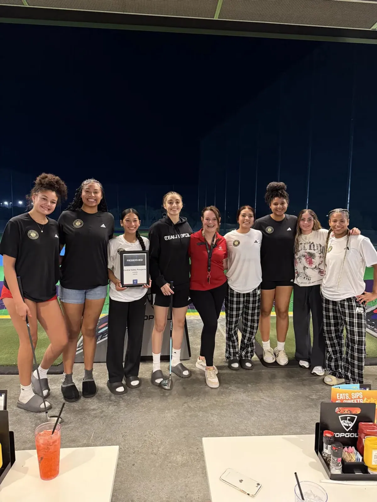 people sitting near table with laptop computer
