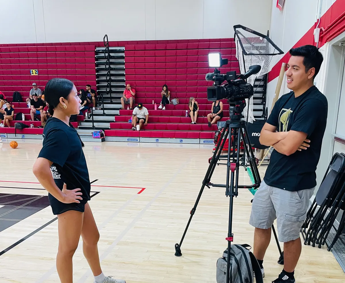 people sitting near table with laptop computer